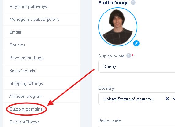 Settings interface with user profile image and name "Danny" on the right. A red arrow points to "Custom domains" in the left menu.